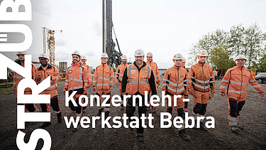 Foto von einer Gruppe Personen in Arbeitsschutzkleidung